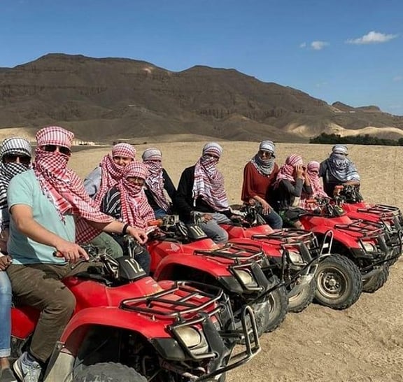 Sunset Desert Quad Bike Safari with Camel Ride and Bedouin Dinner From Hurghada