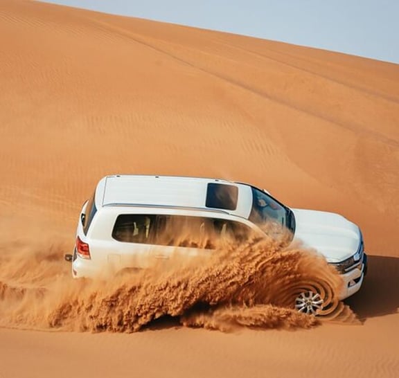 Dubai: Jeep Desert Safari, Camel Ride, and Quad Bike Tour