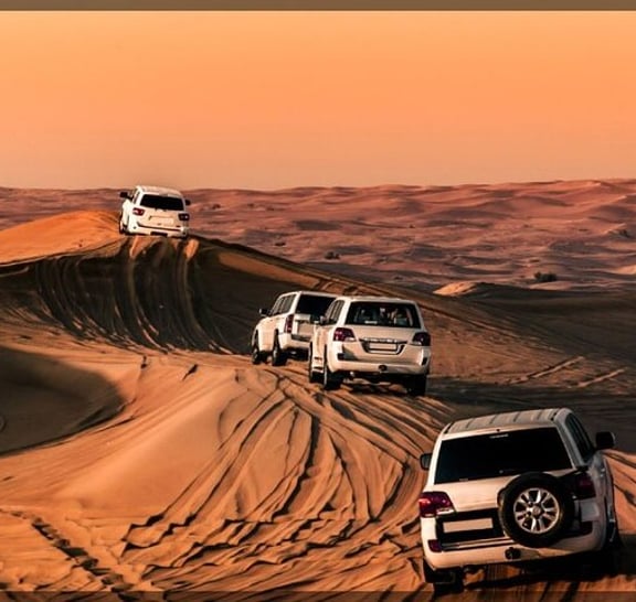 Evening Desert Safari Dubai With Buffet, Dune Bashing, Camel Riding, and Tanura